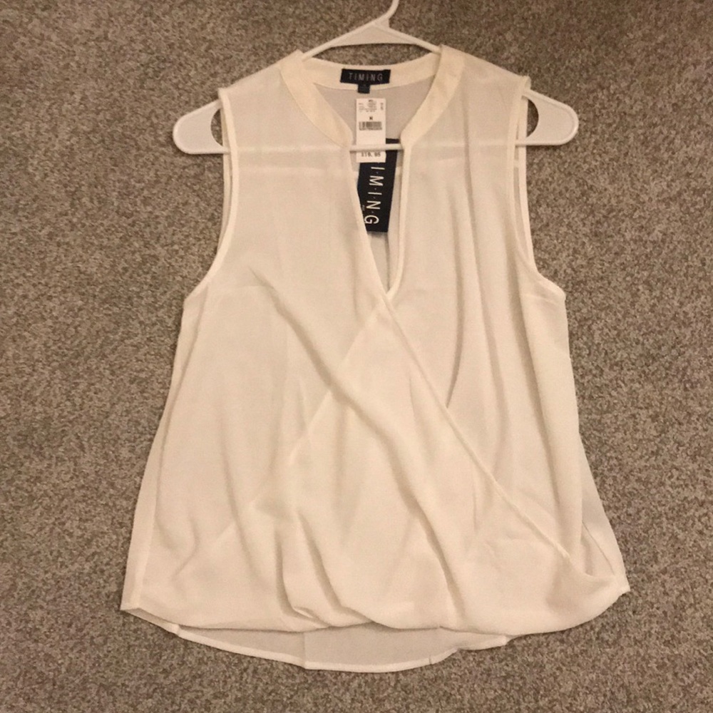 White sleeveless top